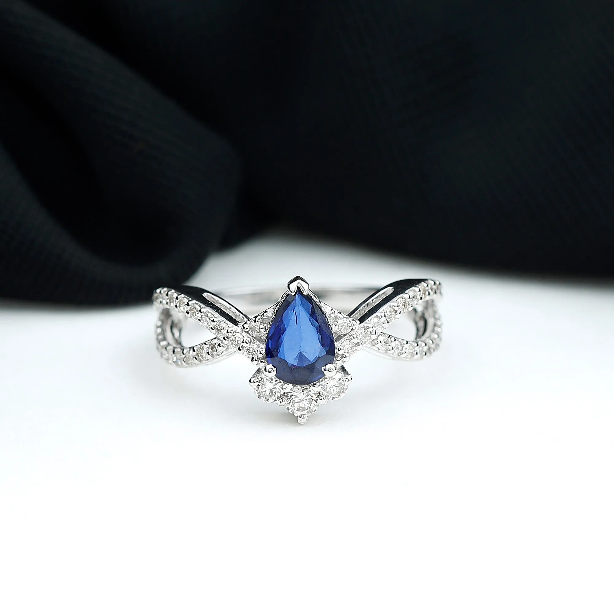 1.75 CT Pear Cut Blue Sapphire and Diamond Crossover Engagement Ring