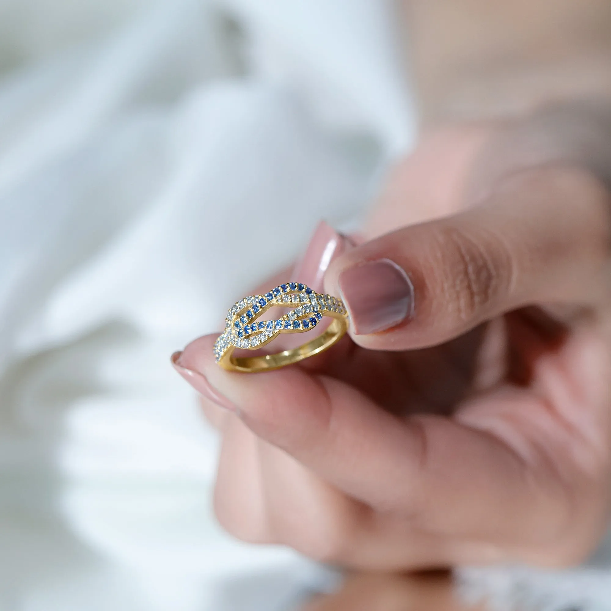 Blue Sapphire And Diamond Interlock Infinity Ring