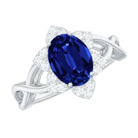 Created Blue Sapphire and Diamond Flower Halo Engagement Ring