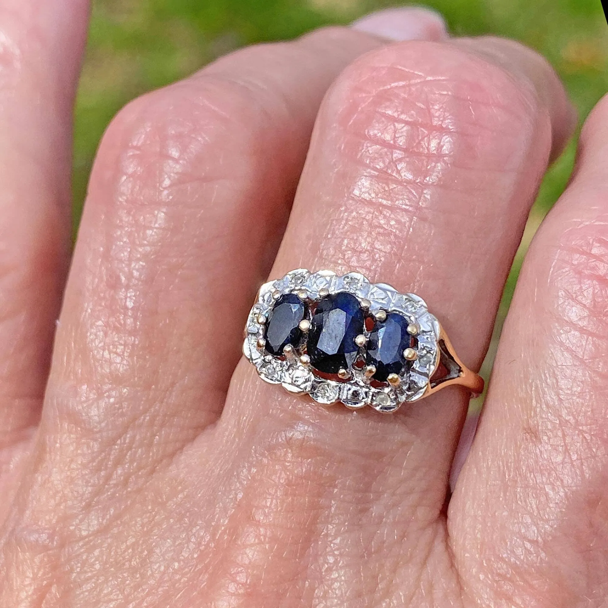 Diamond Halo Three Stone Sapphire Ring in Gold