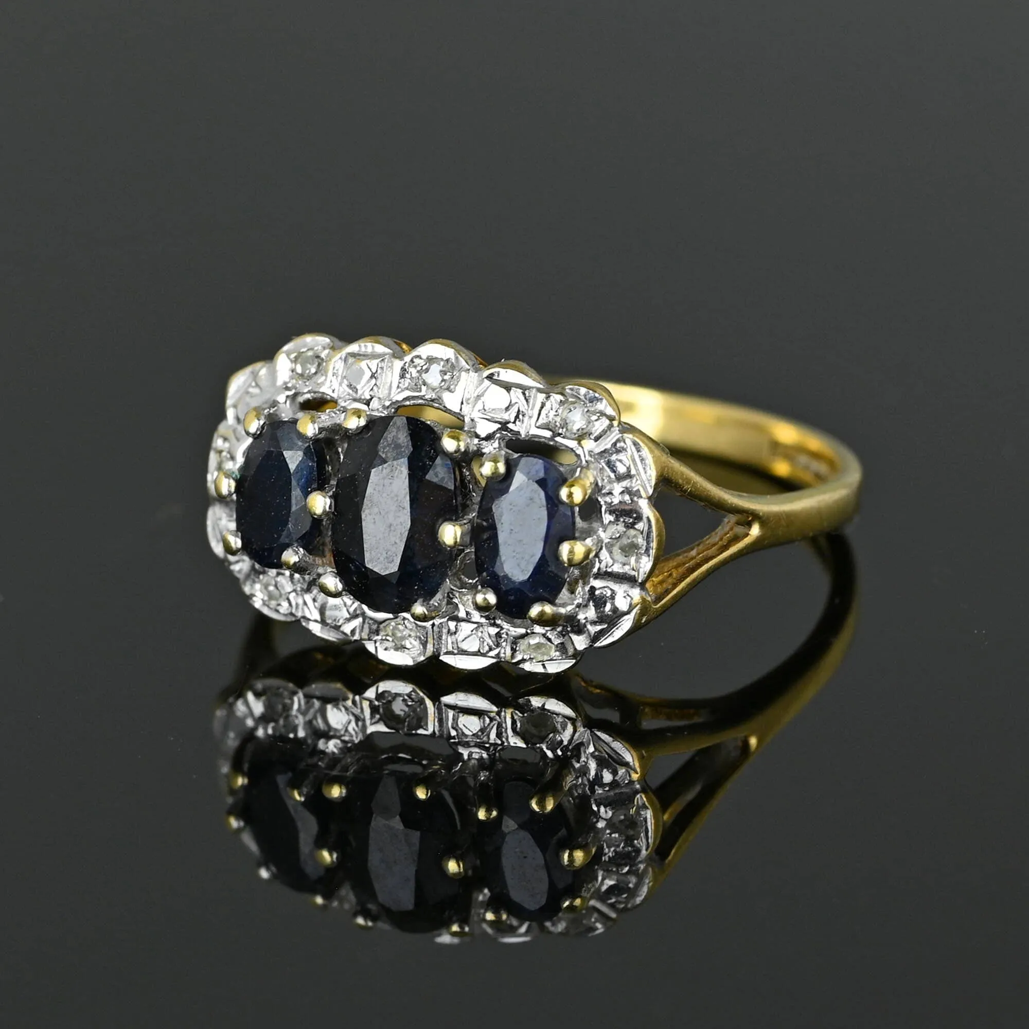 Diamond Halo Three Stone Sapphire Ring in Gold