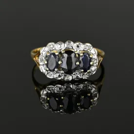 Diamond Halo Three Stone Sapphire Ring in Gold