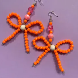 Orange beaded bow earrings